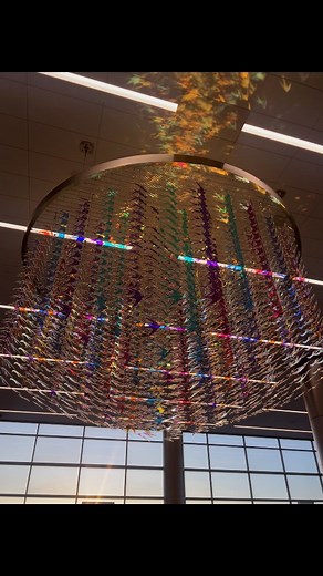 Art in Motion ✈️🕊💫 Swallows in Flight, the newest suspended sculpture at Salt Lake City Airport, forms a spiraling "necklace" that shimmers and shifts color as light changes throughout the day... transforming airspace into art space✨️ #SwallowsInFlight #ArtInMotion #SLC #ArtInAirports #suspendedsculpture | Gordon Huether Studio