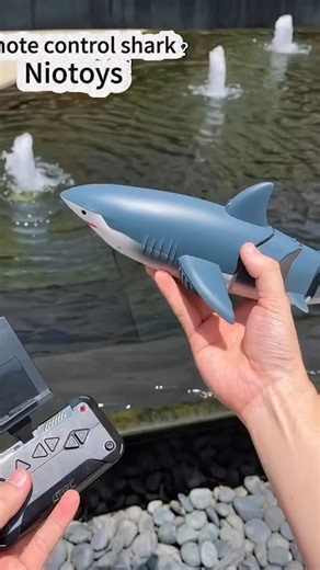 NioToys on Instagram: "**🦈 Dive into Fun with the Remote-Control Shark Toy! 🌊** Turn your living room into an *ocean adventure* with this **hilariously lifelike swimming shark**! Perfect for pools, bathtubs, or epic floor chases. ⚡ **Key Features**: - **Full RC Control**: Zigzag through water or carpet like a real predator! - **Super Agile**: 360° flips and speedy getaways Great for: • Scaring siblings (harmless fun!) 😱 • Pet entertainment (cats *love* to hunt it!) 🐱 • Pool party antics 🎉 #