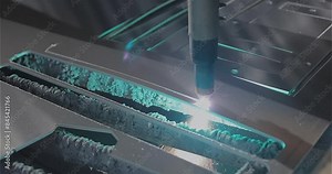 A plasma cutter cuts a detail, close-up. The work of the CNC plasma cutter. The work of a plasma cutter close-up.