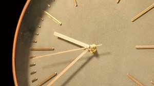 Modern Clock Face Fast Time Lapse. Wood and bronze modern clock ticking accelerated time. Time flies moving fast forward in this time lapse. Clock face running out in high speed.