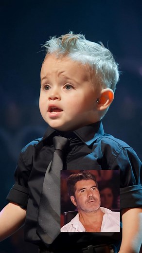 Simon Cowell NEVER cries… until now. The moment this tiny boy opened his mouth to sing, the audience froze, jaws dropped, and Simon’s eyes welled up. One note changed everything—and history was made on that stage. You won’t believe what happened next. Watch the full video in the comments 👇 | American Vibes