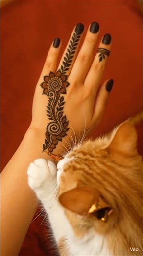 A cat is creating a beautiful mehndi design #mehndi #henna #hennadesign