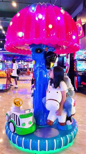 Giera Riding a Cute White Mini Horse Carousel