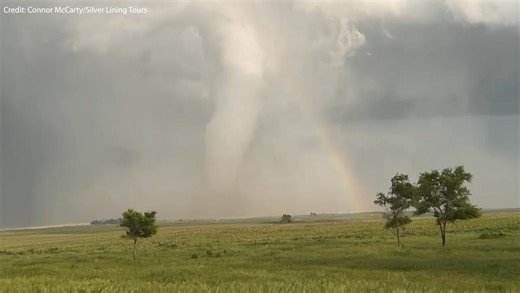 'Spectacular' moment an enormous tornado crosses a rainbow
