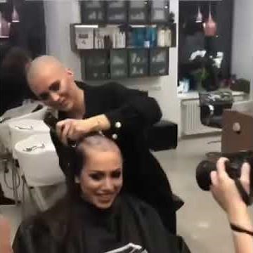 Bald barberette shaves girl