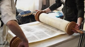 Hand of young boy reading the Jewish Torah at Bar Mitzvah Bar Mitzvah Torah