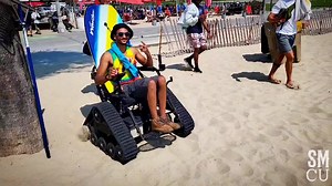 Andrew Ekelem, with his associates from Evolution Devices, rides on an electric all terrain wheel chair at Santa Monica Beach, Tuesday, August 24, 2021. The City of Santa Monica offers complimentary electric all terrain wheel chair rentals. Motorized wheelchairs makes crossing the sand easier for people with disabilities or limited mobility. The Motorized wheelchair rentals are available for use by the public at two locations: Perry’s Café at 1200 Ocean Front Walk and Perry’s Café at 2400 Ocean 