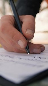 Writing Notes to Open Your Mind on Sheet Music Outdoor