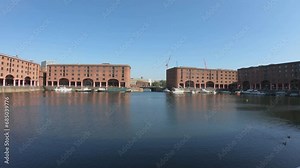 Liverpool, England, September 9, 2023: PAN SLOW The Royal Albert Dock is a complex of dock buildings and warehouses in Liverpool. Designed by Jesse Hartley and Philip Hardwick, it was opened in 1846.