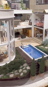 This revolving beautifully landscaped miniature house is one of my favorites at the Museum of Mini Houses in Indianapolis! But maybe I would remodel the pink bathroom. You?🤣💗🚽🌴💦 #minis #dollhouseminis #dollhouse #miniatures | Mad About Miniatures