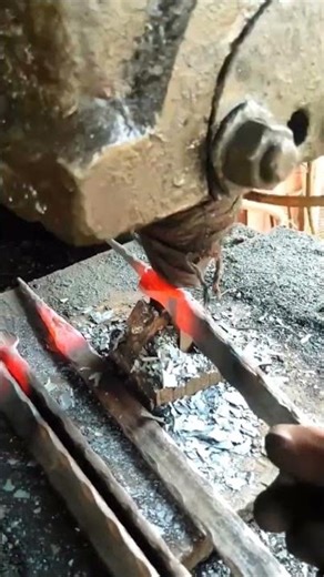 Watch a Master Blacksmith Forge an Iron Fence.