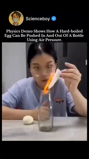 Deepak Kumar on Instagram: "This classic demo illustrates air pressure. To get the egg in: Light a paper inside the bottle and place the peeled egg on top. The fire heats the air, which expands and partially escapes. When it cools, the air contracts, creating lower pressure inside. Atmospheric pressure (~14.7 psi) pushes the egg through the neck. To get it out: Invert the bottle so the egg is at the neck, then submerge in hot water or blow into it. This expands or increases internal pressure, fo