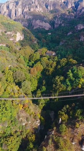 Step onto the thrilling 160-meter-long Khndzoresk Swinging Bridge, where each sway takes you from the present into the past. One side: New Khndzoresk. The other: the cinematic silence of Old Khndzoresk, a ghost village lost in time. 🌉🌄 Who would you explore this mysterious site with? 📍Syunik Region #Armenia #TheHiddenTrack | Armenia.Travel