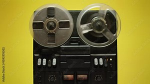 Tape audio music player, studio magnetic tape, vintage retro spool reel to reel player and recorder, magnetic tape data storage close up, music studio.