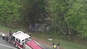 Serious crash on I-495 leaves vehicle on roof in woods