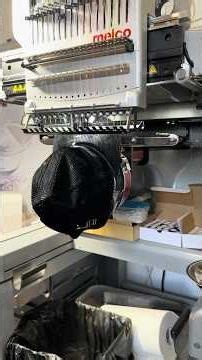 Melco Cap attachment putting on Melco Embroidery Machine