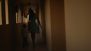 Mother and son in hotel hall
