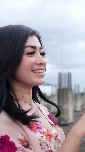 Romantic Outdoor Moment with Floral Dress and Pink Shirt