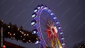 high roller, ferris wheel, amusement park. Oservation wheel, multi-colored Ferris wheel, with cabs for observation, part of an amusement park attraction, a metal construction of an observation wheel