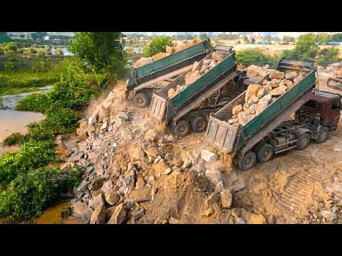 Sinking Risk Heavy Red Truck Discharging Massive Rocks into Deep Water