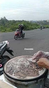 A beautiful girl is waiting to cook chocolate topping crepe #streetfood #livecookingshows #cooking