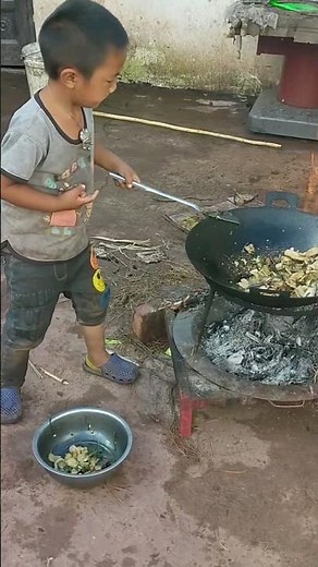 Adorable little boy cook food