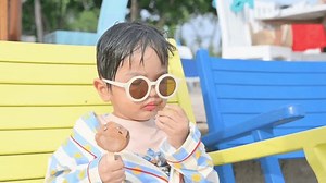 Boy Sitting On Beach Chair Eating Stock Footage Video (100% Royalty-free) 1106857039 | Shutterstock