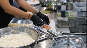 Sushi making process Master class. Step by step Video set male chef makes sushi and rolls from rice, red fish and avocado. Cook's hands close-up.