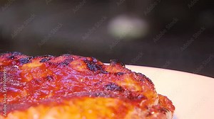 cooking the meat on the grill in the fireplace in the restaurant