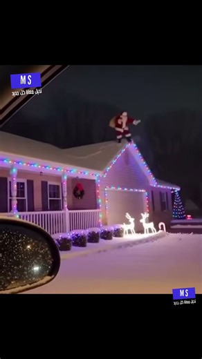 Santa Claus falls off the roof during Christmas decoration