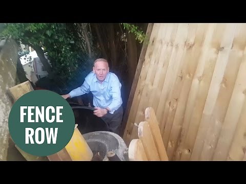 Angry millionaire caught tearing down neighbour's fence