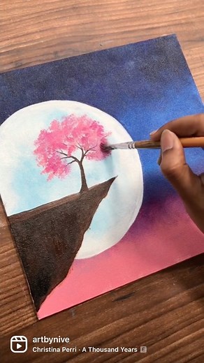 Nive | Artist on Instagram: "Moonlight and Cherry blossoms 💙🌸 Tutorials can be found on my YouTube channel “Nive art” , Do share your thoughts below :) Materials: Surface: canvas 10*10 inch Paints: @kokuyo.camlin @liquitexofficial Brushes: @princetonbrush If you have read all the way till here , love you 💕 and take care :)"