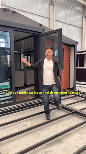 This 20ft modular home comes with a stylish outdoor terrace — perfect for relaxing or enjoying a cup of coffee in the morning. Inside, it features two cozy bedrooms, one modern bathroom, a spacious living room, and an open kitchen with cabinets. Fully wired, plumbed, and ready to use upon delivery. Ideal for backyard living, rentals, or countryside retreats. #Modularhome #prefabhome #containerhome #tinyhouse #portablehome | Container Home Designs