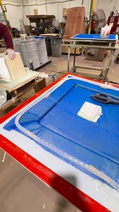 By vacuum infusing these smaller molds, we control exactly how much resin goes into the laminate, get a more consistent fiber-to-resin ratio, and keep the shop cleaner than a traditional hand layup. The blue flow media you see before the bag goes on is what helps the resin travel evenly across the part once we pull full vacuum. #NuWaveComposites #vacuuminfusion #resininfusion #compositesmanufacturing #fiberglass #boatbuilding #closedmolding #cleanerlaminates #processcontrol | NuWave Composites