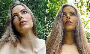 Robyn Lawley gets her hair prepared as she takes on the runway