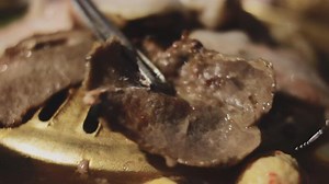 Download A close up of meat being cooked on a plate for free