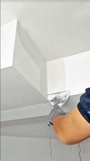 Achieving Perfect Corners: Applying and Smoothing Joint Compound on Drywall Ceilings