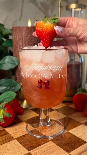 Laura Krecic on Instagram: "Strawberry Moscow Mule 🍋‍🟩🍓 Comment MULE for the exact brands I used Ingredients: 2 oz vodka 1 oz strawberry @monin_usa syrup 3/4 oz fresh lime juice Ginger beer, to top Ice Garnish: lime wedge, fresh strawberries, (optional) How to Make It: Add vodka, strawberry syrup, and lime juice to a glass or copper mug. Fill with ice. Top with ginger beer. Give it a quick, gentle stir. Garnish and serve. HomeWithLauraK | Strawberry Moscow Mule | Moscow Mule Recipe | Strawber