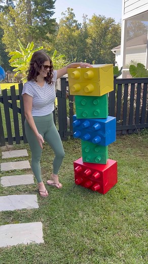 Here’s how I made an XL cardboard box LEGO stack for Luke’s birthday party! Super easy and inexpensive to make, I just wish I had made more! #lego #legoparty #birthdaypartydecor #legocrafts | Crafts, Decor and Family Fun with Morgan McBride