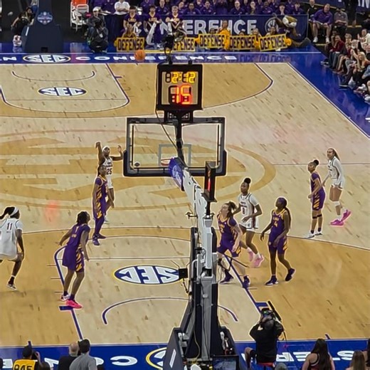 Joyce Edwards with a bounce pass while on the floor, 3 pointer by Raven Johnson