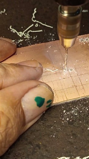 Drilling holes in the printed circuit board for the dc buck converter circuit