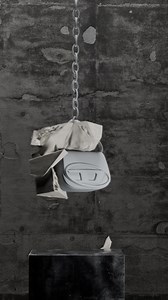 Break the mold. The newest version of the 1DR bag is crafted in robust, matte rubberized leather and a thick chain link strap. The signature Oval D metal hardware is rubberized for an indestructible effect. Shop at http://www.diesel.com/1DR #ForSuccessfulLiving #DieselSS24 | Diesel