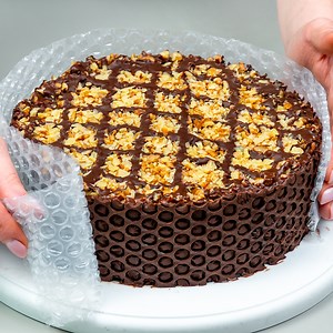 770K views · 6.7K reactions | No one believes that I do it myself! Chocolate dessert, better than in patisseries Ingredients: biscuits: 500 g (18 oz) walnut: 200 g (7.1 oz) milk: 400 ml (14 fl oz) sugar: 100 g (3.5 oz) vanilla sugar: 10 g (0.4 oz) cocoa: 80 g (2.8 oz) butter: 100 g (3.5 oz) walnut: 80 g (2.8 oz) milk chocolate: 200 g (7.1 oz) oil: 20 ml (0.7 fl oz) | Cookrate | Facebook