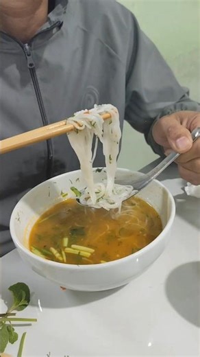 The love story of the boatwoman on the river eating Hanoi bun cha.