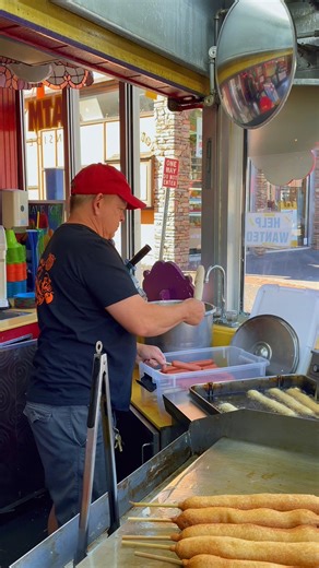 Watch the magic happen — every Ogle Dog is hand-dipped fresh and fried to golden perfection. That’s what makes it a Gatlinburg legend. | Fannie Farkle's