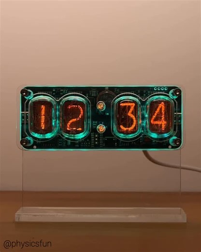 physicsfun on Instagram: "Nixie Tube Clock: a timepiece featuring a blend of modern LEDs and the retro orange glow of neon excitation via vintage Nixie cold cathode tubes. The “Numeric Indicator eXperimental 1” or NIX 1 was introduced in 1955 by Burroughs Corporation and manufactured until the 1990s. The clock shown here uses modern electronics to power Russian versions called the ИH-12 where the numbers are stacked so the front symbols obscure each lighted cathode minimally: from back to front 