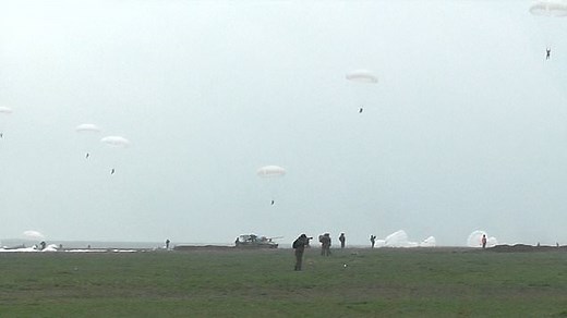 Russian paratroopers leap from plane during military exercise
