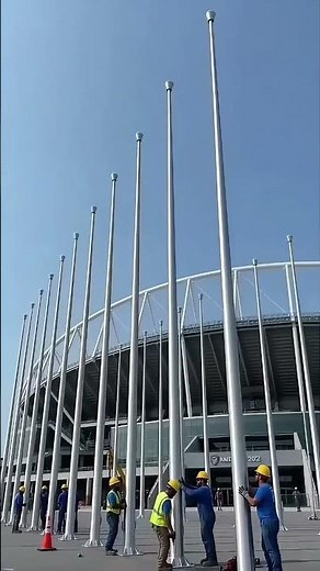 Installation of 50-foot commercial aluminum flagpoles at large gymnasiums & sports arenas.