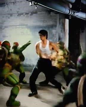 Bruce Lee uses nunchucks to fight with several teenage mutant ninja turtles.