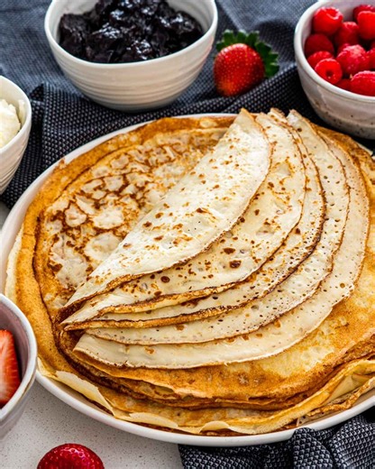 9.4K views · 67 reactions | My mom taught me how to make these crepes when I was just a kid, and I’ve been flipping them ever since. Thin, tender, and ready to fill with whatever your heart desires. Recipe—https://www.jocooks.com/recipes/crepes-clatite/ | JoCooks | Facebook